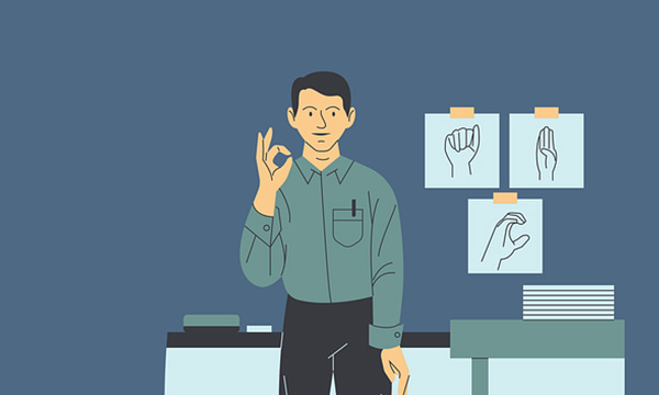 male teacher at the front of the class teaching
    ASL